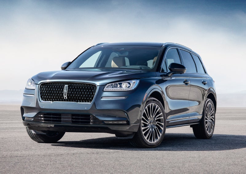 A 2022 Lincoln Corsair Sport Package model is parked on pavement with a hazy blue sky in the backdrop showing off sharp design cues | Performance Lincoln Bountiful in Bountiful UT