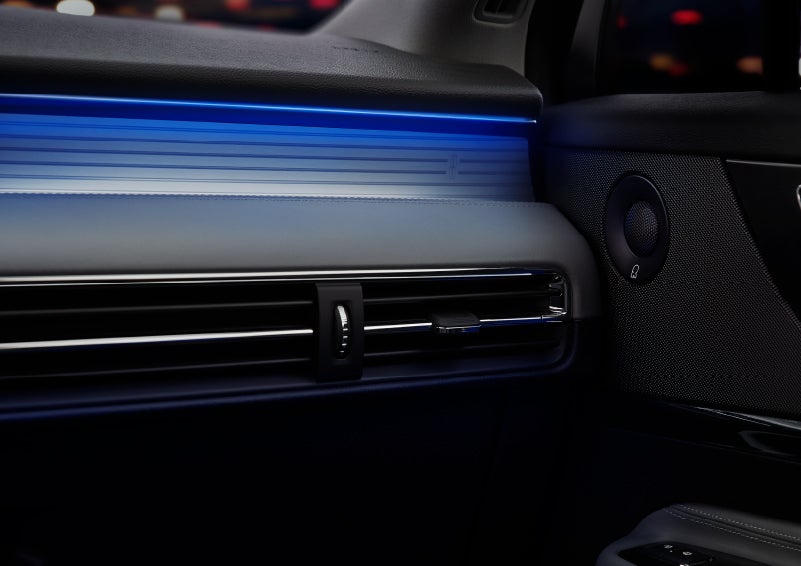 A thin available ambient blue lighting illuminates the pinstripe aluminum under an ebony dashboard, emitting a cool energy | Performance Lincoln Bountiful in Bountiful UT