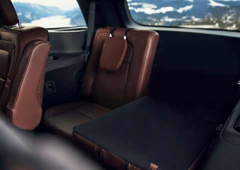 The left rear seat of a 2024 Lincoln Aviator® SUV is shown folded flat for additional cargo space | Performance Lincoln Bountiful in Bountiful UT