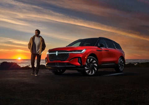 A person is shown next to a 2024 Lincoln Nautilus® SUV as the Lincoln Embrace sequence takes place. | Performance Lincoln Bountiful in Bountiful UT